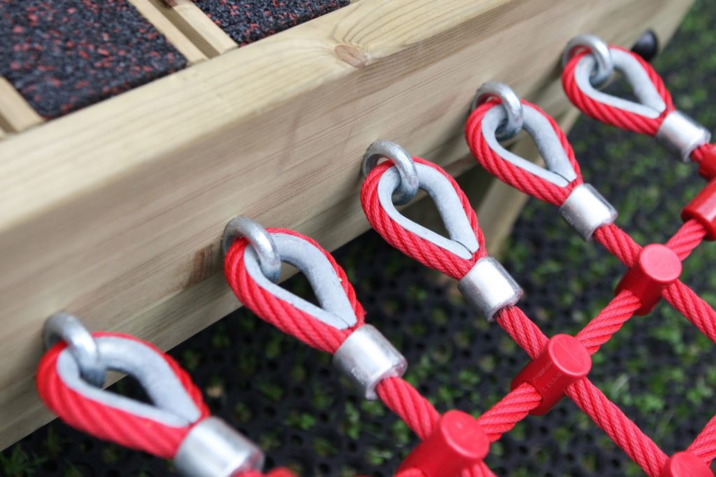 Bright red rope used in a climbing net for children