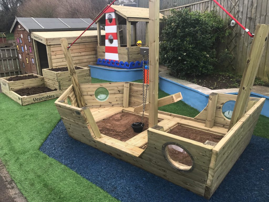 A large wooden play boat installed in the primary school playground