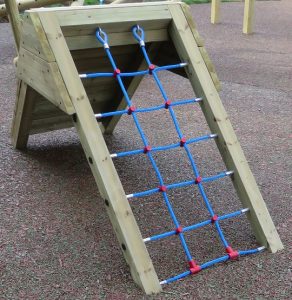 Wood ramp with play net installed on safety surfacing