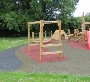 Wooden monkey bars over safet surfacing