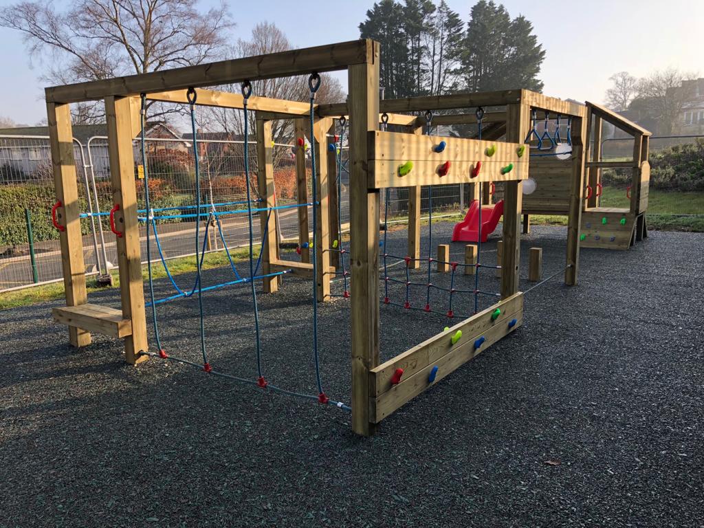 Timber play equipment of safety surfacing