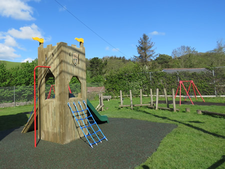 Wooden play tower in play space