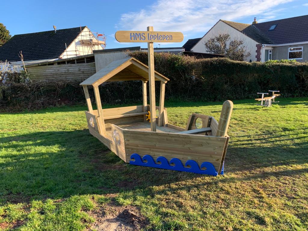 An outdoor play boat in a play park