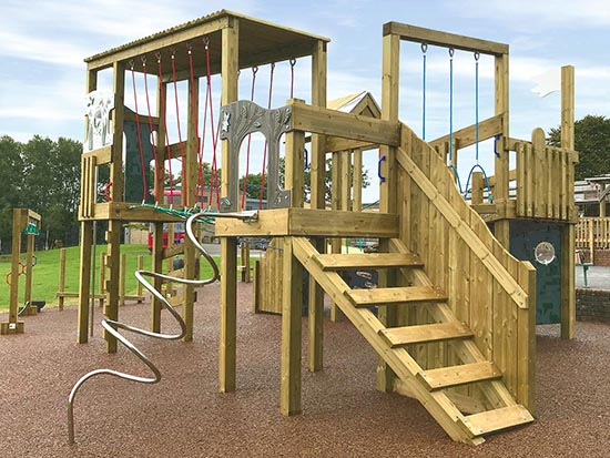 A play area with wooden play equipment