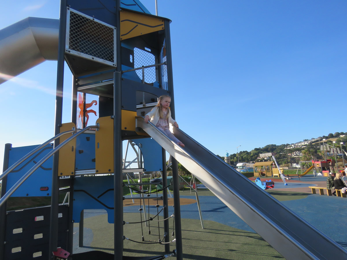 A long slide installed in a play area