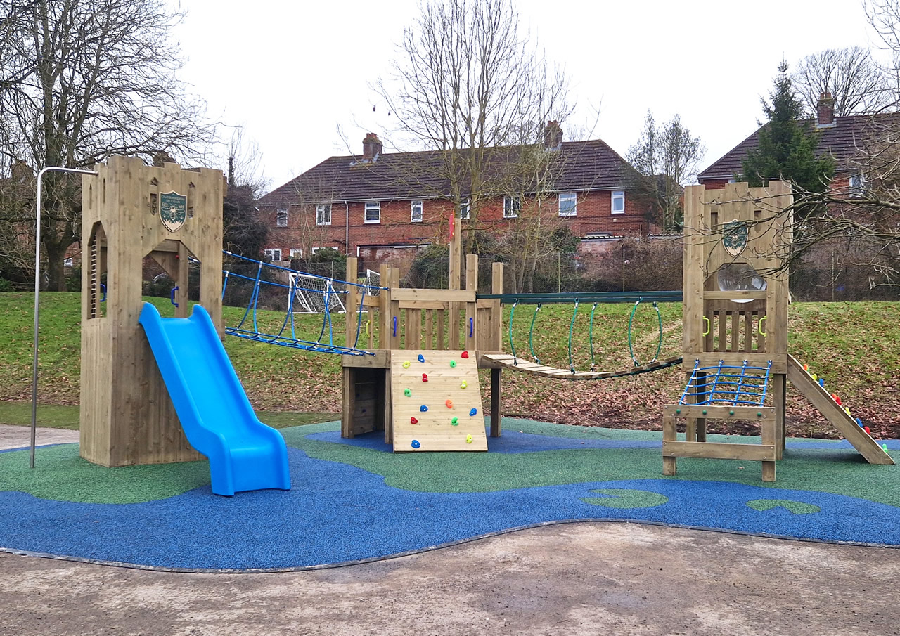 The play space at St Marys showing the wooden play equipment