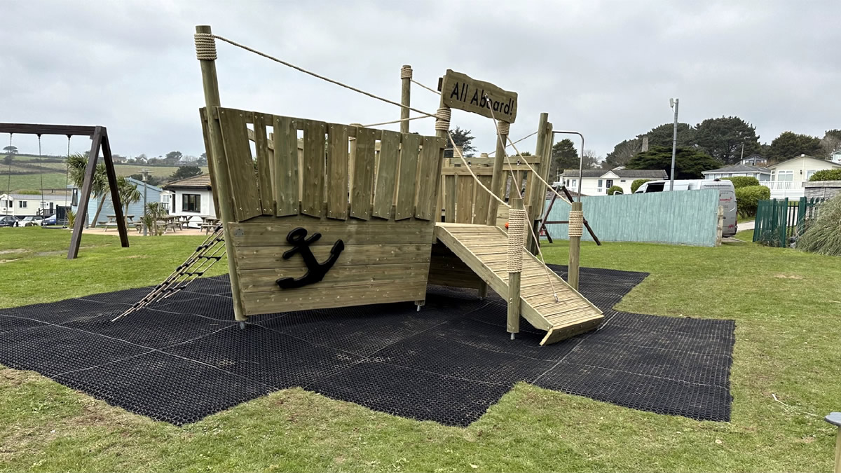 A wooden play boat installed at a holiday park in Cornwall