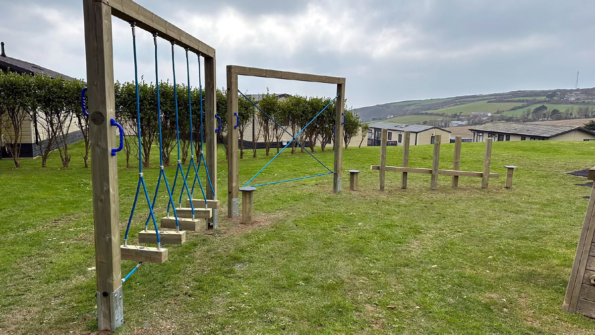 A children's trim trail installed at a holiday park