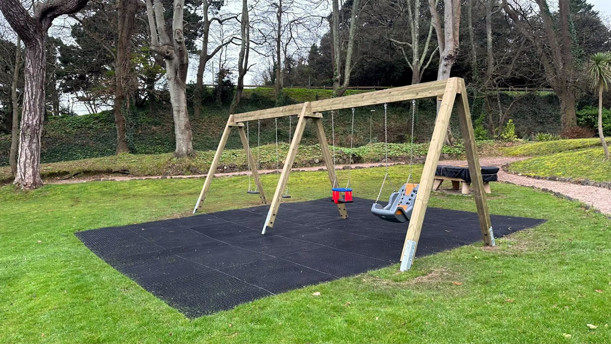 A traditional wooden swing selection installed at a Devon tourist hot spot